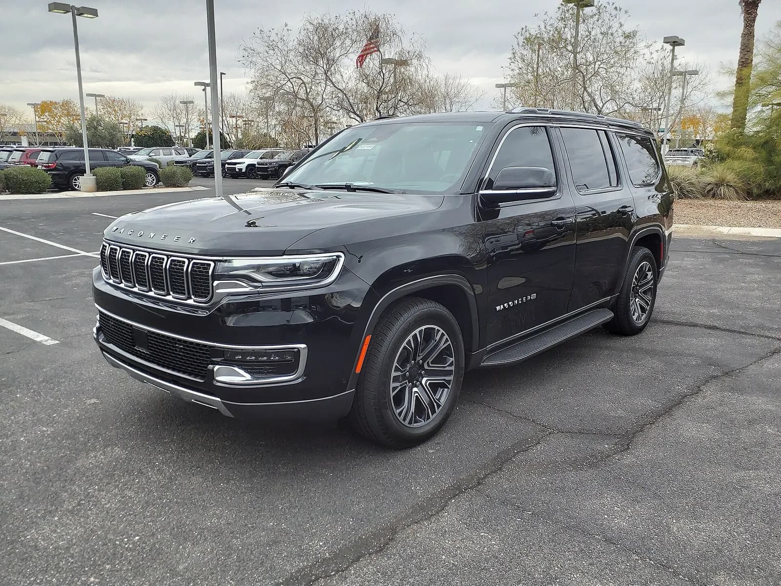 Black Jeep Wagoneer parked in a lot